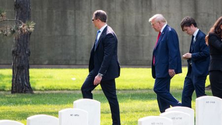 side shot of Trump walking through Arlington Cemetery in August 2024