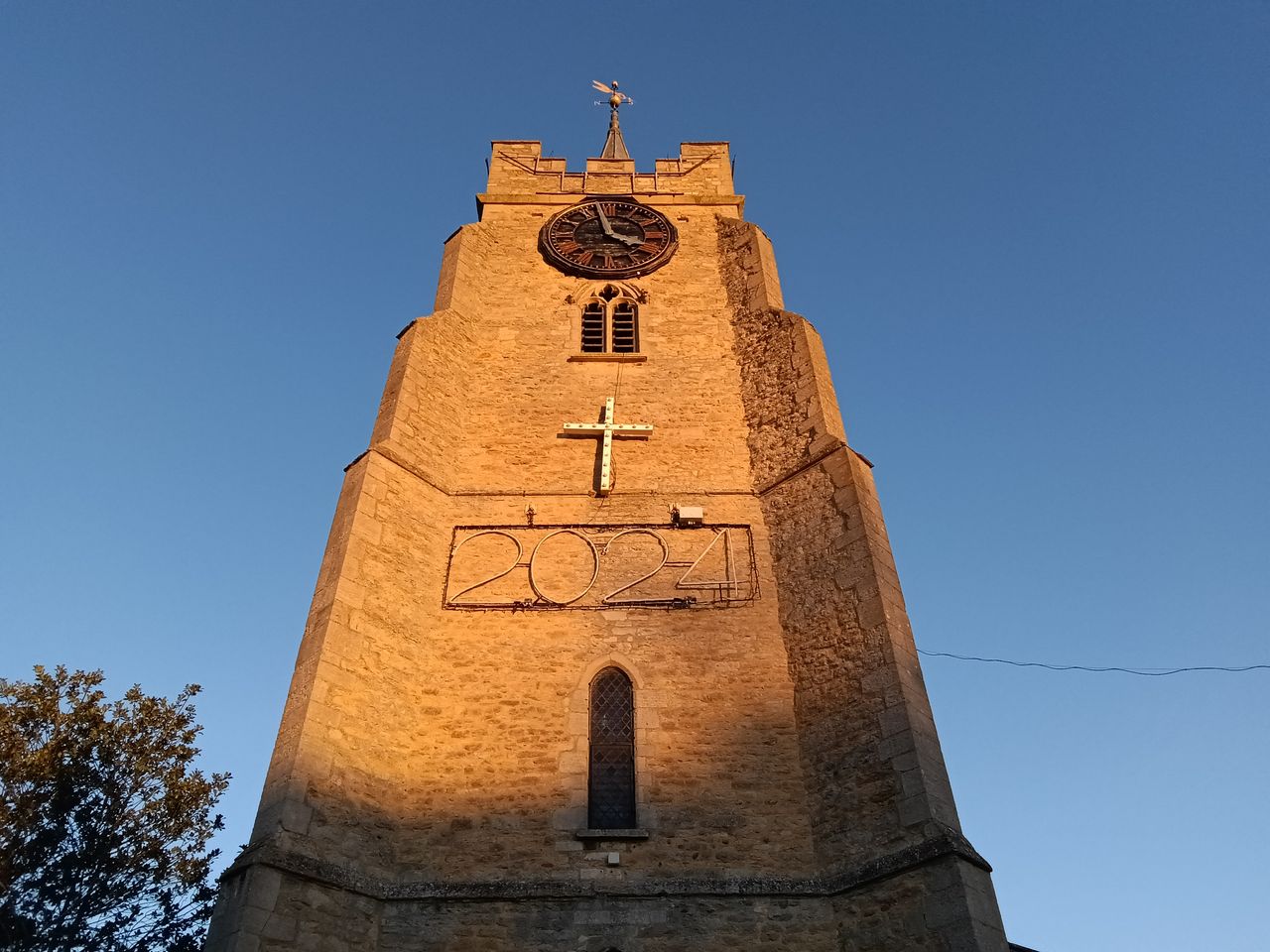 Church spire against a blue sky taken on a OnePlus Pad Go
