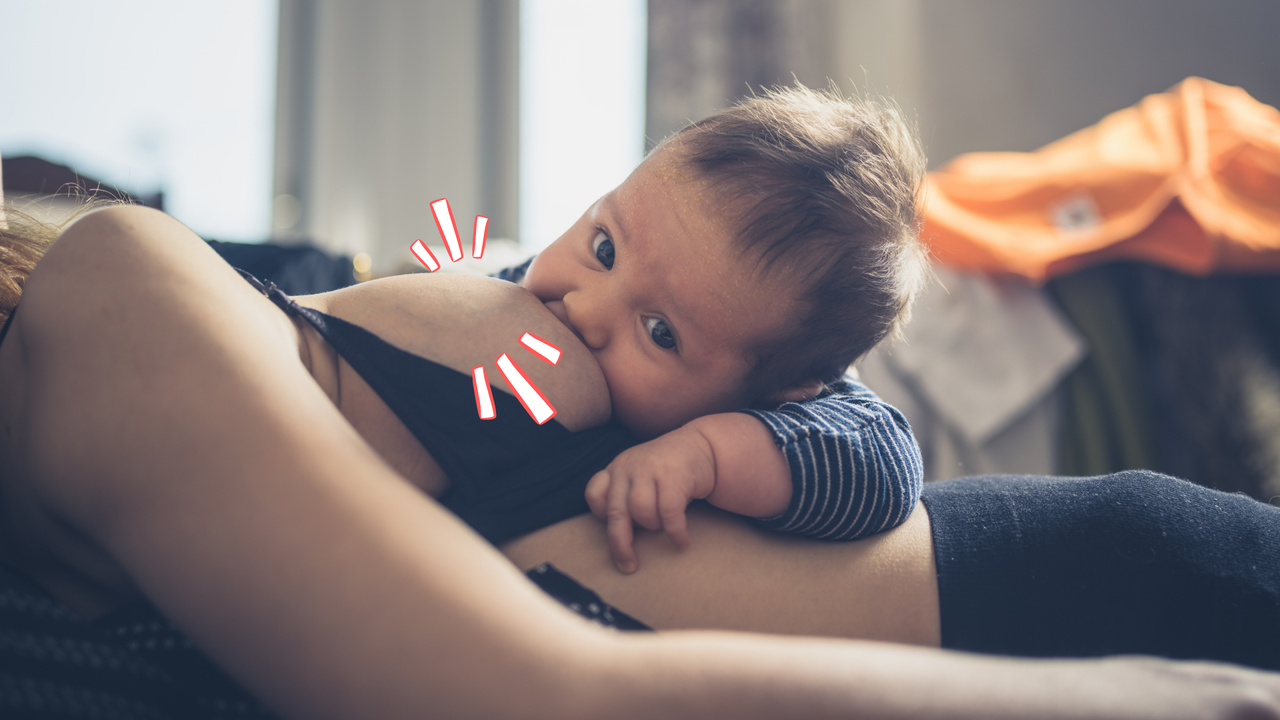 Image of a baby on a woman&#039;s breast feeding