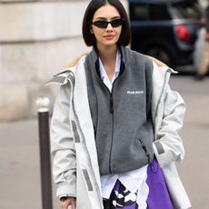 woman in sporty jacket and skirt