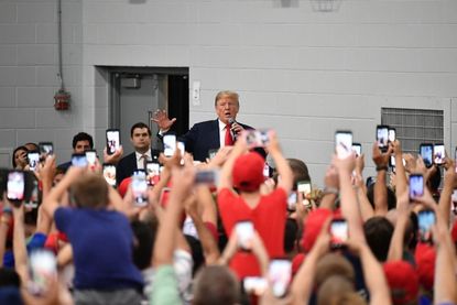 President Trump speaks to supporters in an overflow room before a rally at Olentangy Orange High School in Lewis Center, Ohio on August 4, 2018.