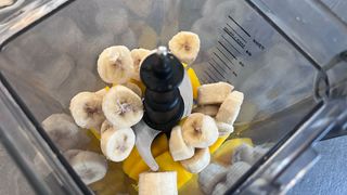 Mango and banana chunks in a blender