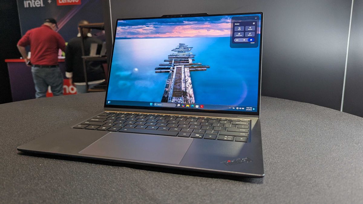 The Lenovo ThinkPad X9 Aura Edition on a desk with its display open.