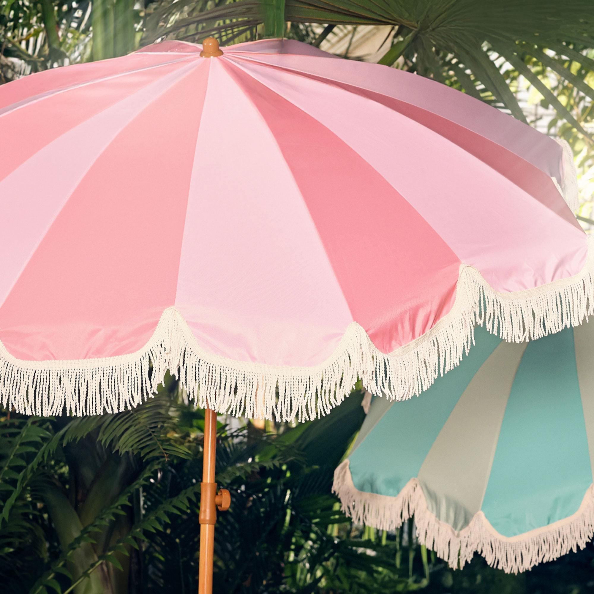 Two toned pink parasol in garden