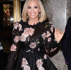 Jenny McCarthy waving with wide smile