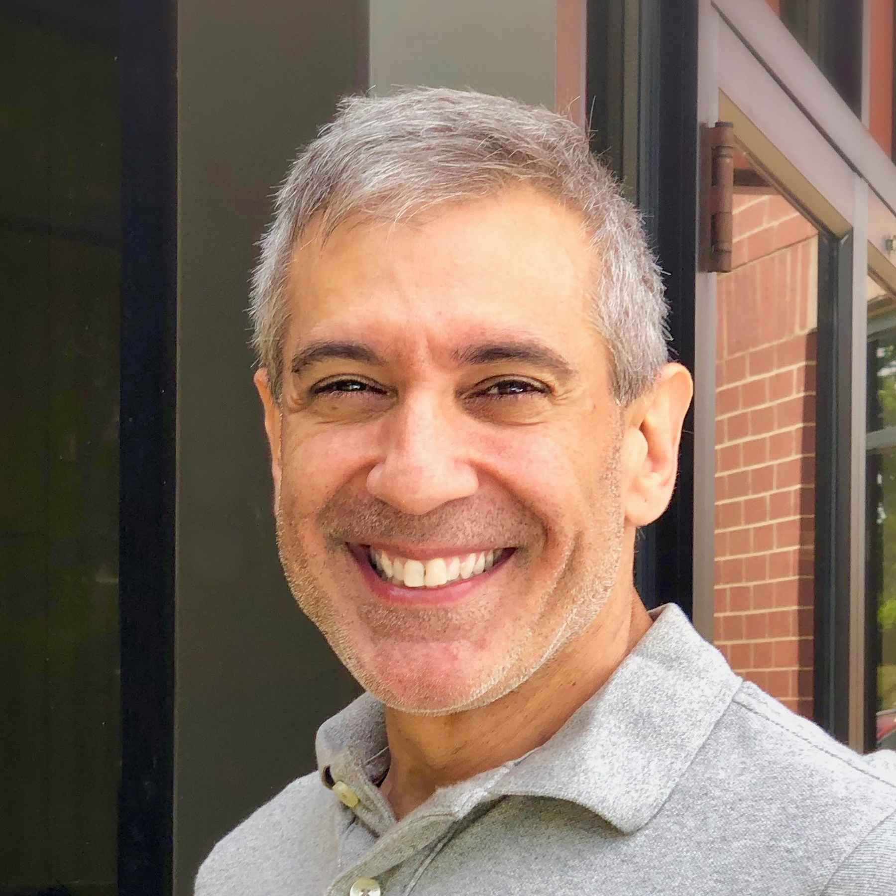 Smiling headshot of Mark Boyadijan.