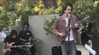 John Mayer (right) jams with two young musicians 