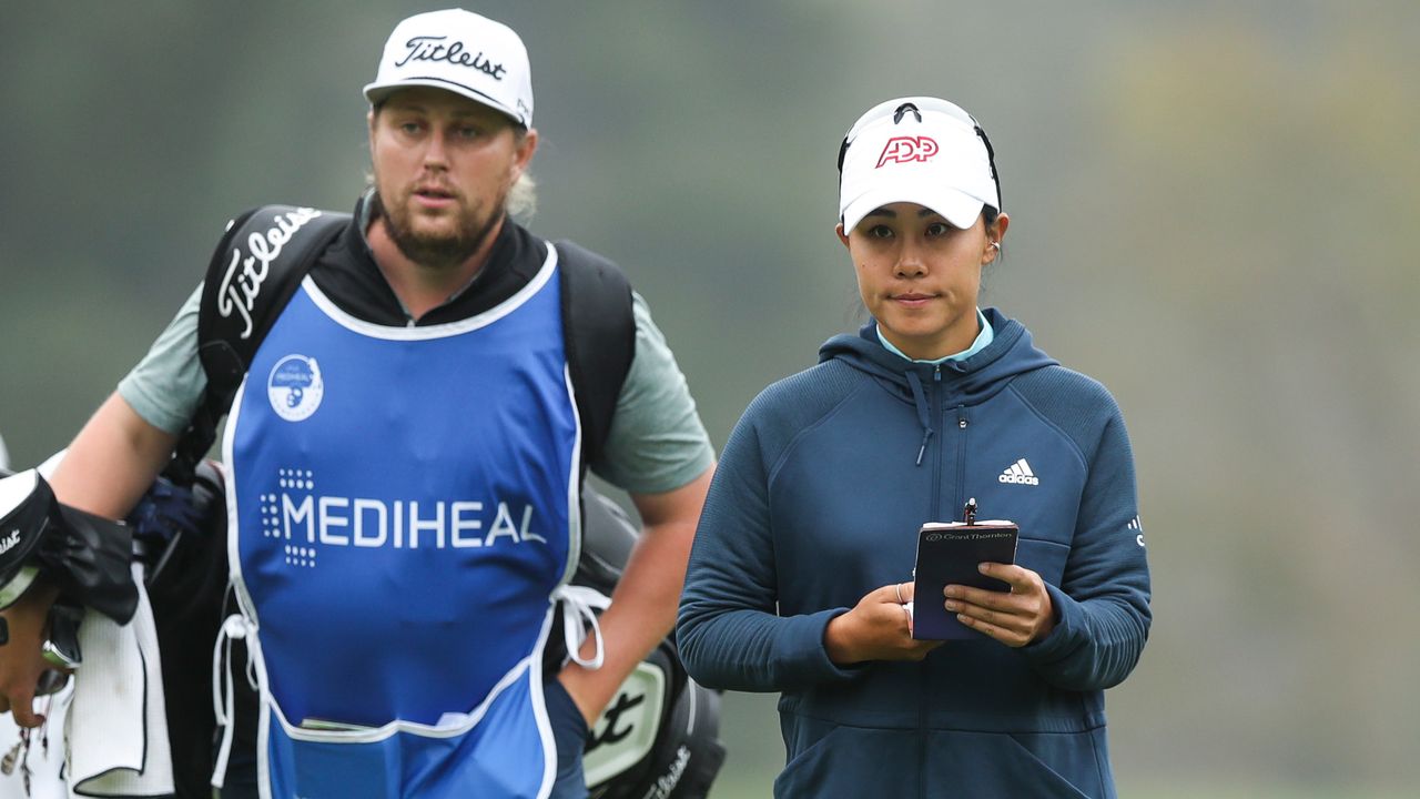 Danielle Kang and caddie walk