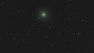 aa green comet in the night sky