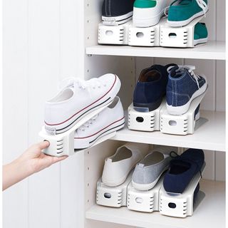 White shelf with shoe stackers