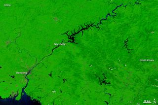 This image, taken by the MODIS instrument aboard NASA's Terra satellite, shows the Yalu River in August 2010, after weeks of rain swelled waterways and caused flooding and mudslides.