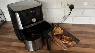 The Instant Vortex Plus next to French Toast made in the air fryer and French Toast cooked on the stove