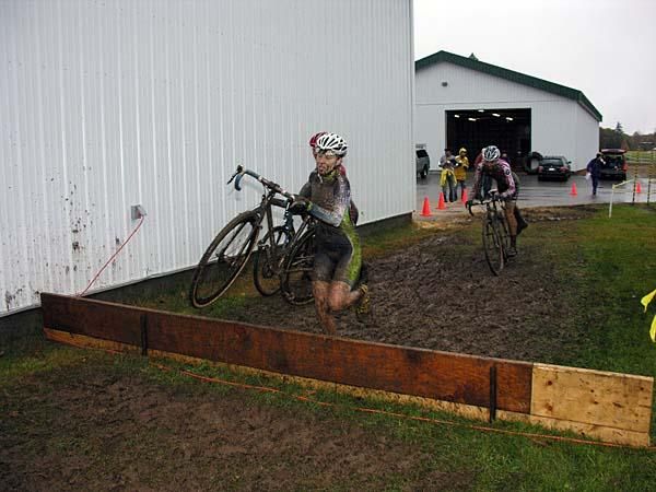 Maureen Bruno Roy runs a barrier by the barn.