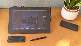Xencelabs Pen Display 16 review; a pen display on a wooden desk