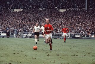 Bobby Charlton in action for England in the 1966 World Cup final against West Germany.