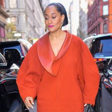 Tracee Ellis Ross wears a white skirt.