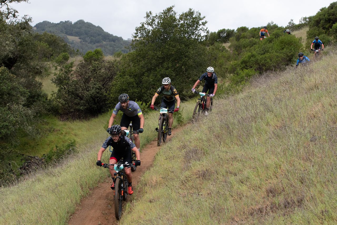 Various riders at the Grasshopper Adventure Series 2022 Mountain Bike Race at Lake Sonoma.