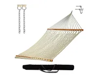 A beige rope hammock with a wooden spreader bar