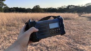 Roberts SolarDAB 99 radio in a field