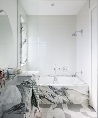 bathroom with marble and gray patterned tiles