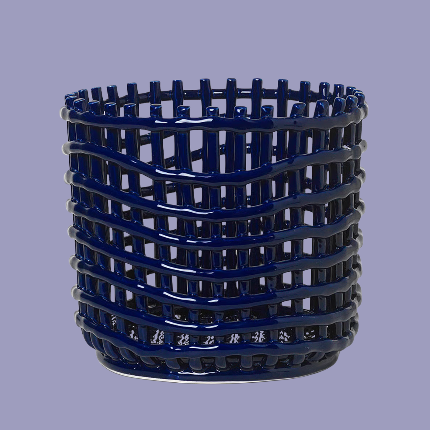 A blue ceramic braided basket