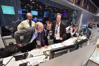 Rosetta Mission Crew Observing Philae Touchdown on Monitors