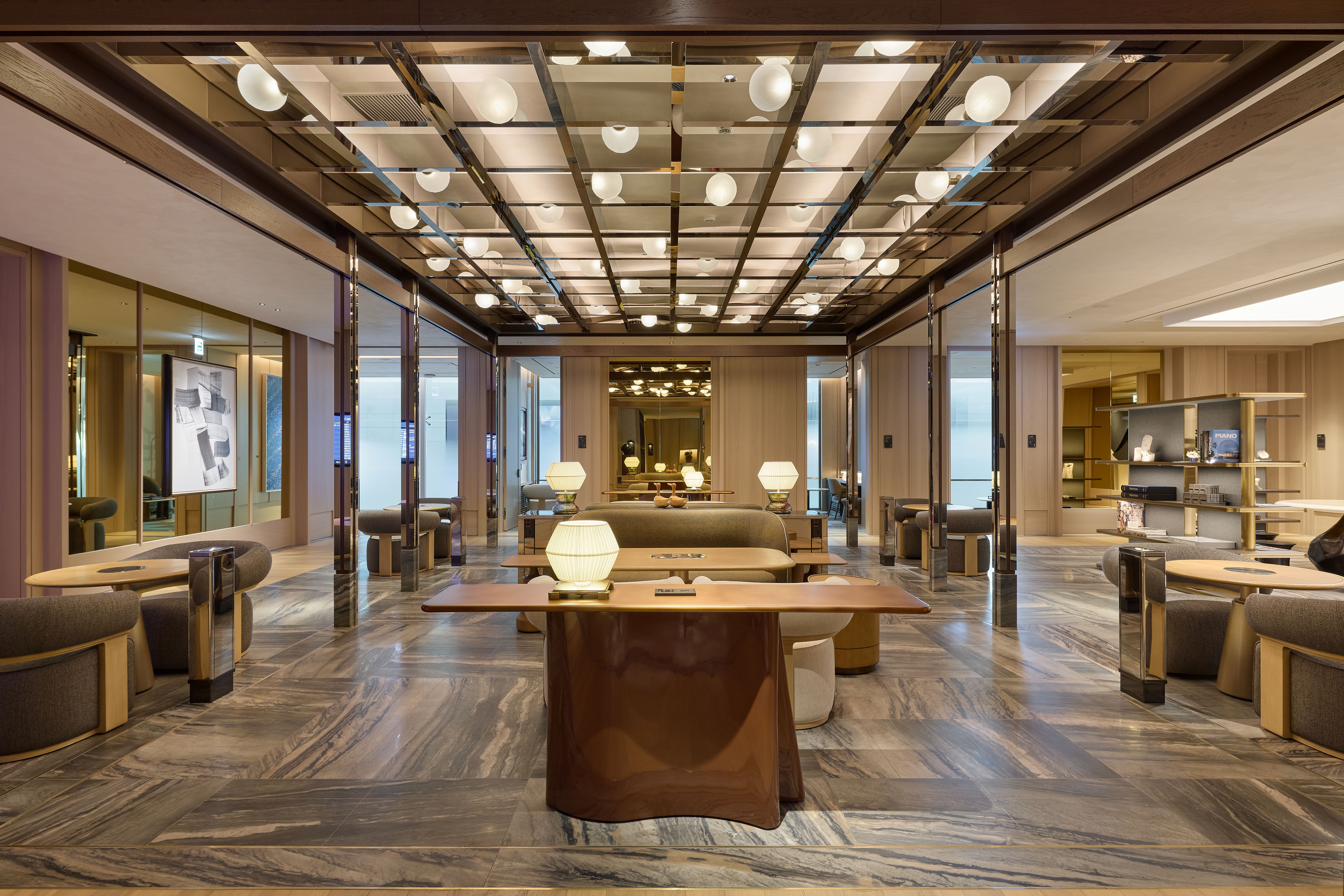 A spacious lounge interior at Incheon International Airport combines contemporary furnishings, natural textures and distinct areas for dining, work and relaxation