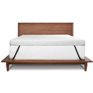 ViscoSoft Active Cooling Copper Topper on a mattress on a bed against a white background.