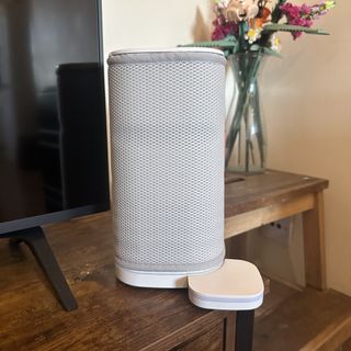 The Vitesy Eteria portable air purifier on wooden TV console