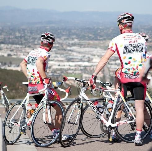 Mike Friedman and Brad Huff look back over the city during a training ride.