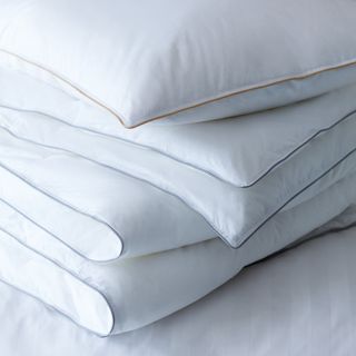 white colour soft blanket and pillow