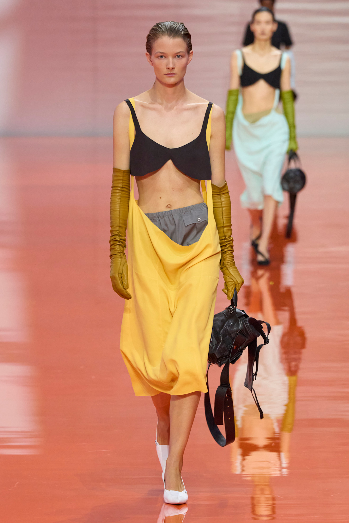 A model wore the black-and-yellow color combination on Prada's Spring 2026 runway