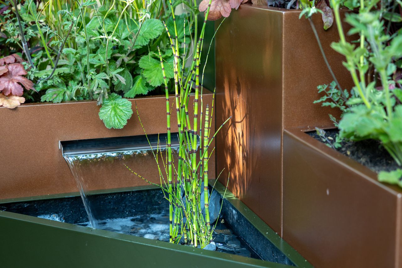 Images and details showing the planting and structure of the transient garden. Lots of brick, leafy greens and brushed metal