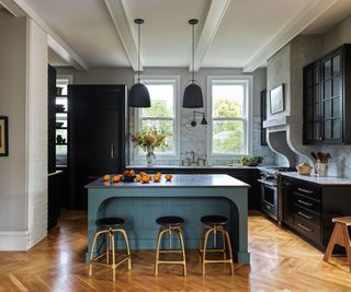 Blue kitchen with island in the center