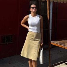 Influencer wears butter yellow trainers.