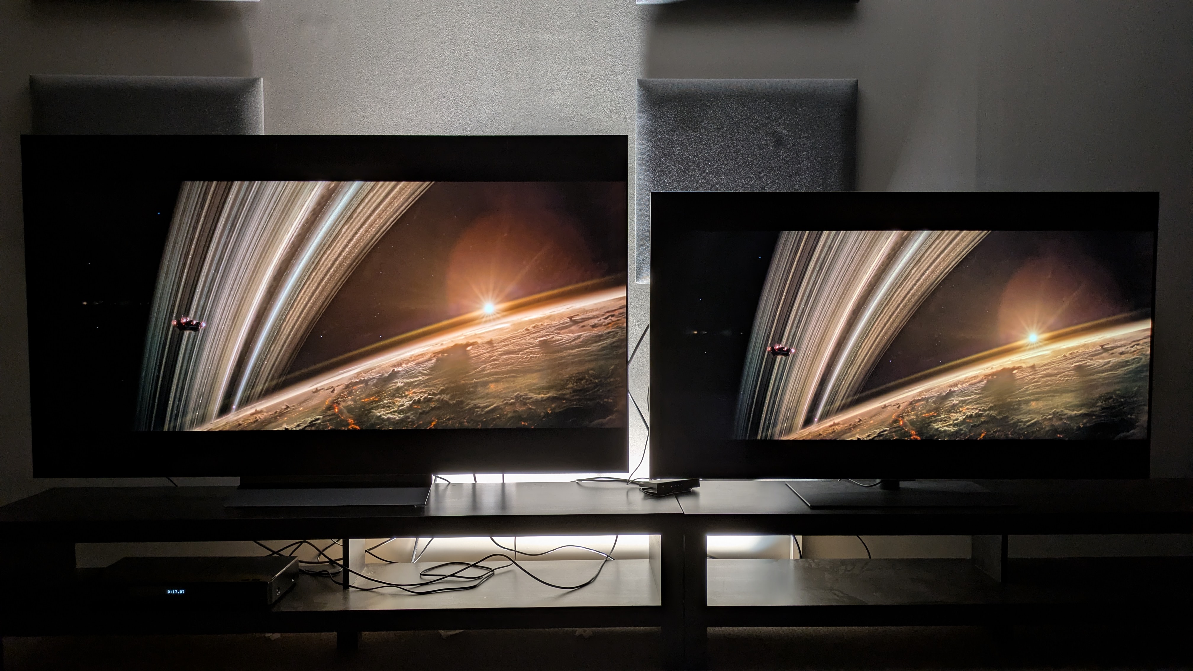 LG C6 (left) and LG G5 (right) with a shot of a planet's edge from Alien: Romulus on screen. The C6 shows more natural contrast, but the G5 has brighter highlights