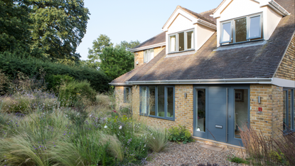 A house surrounded by wild grass