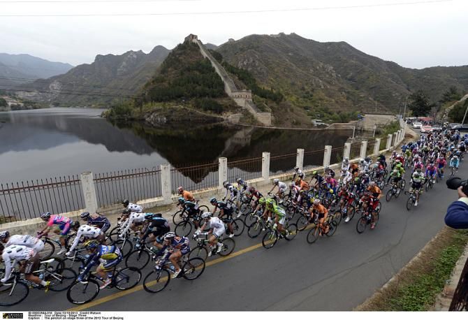 The peloton passes by the Great Wall of China