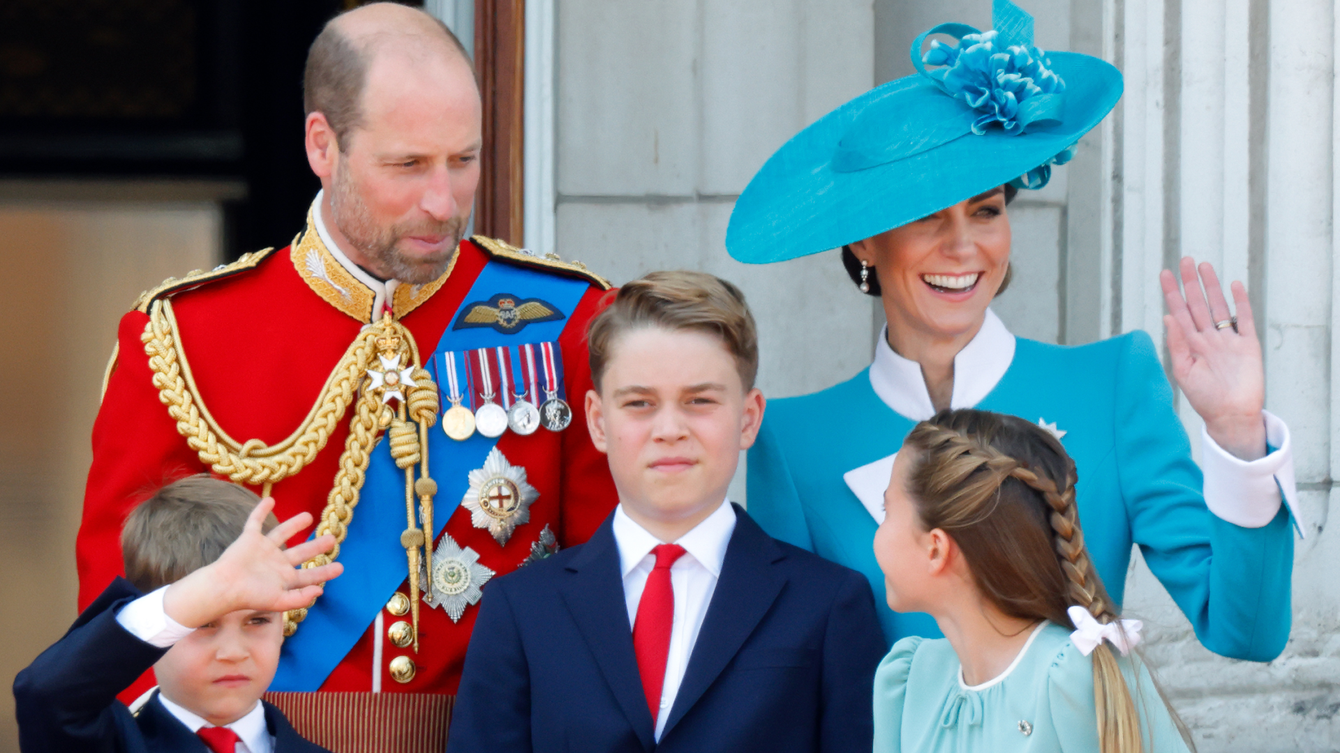 Prince William and Princess Kate on the balcony waving with Prince George, Prince Louis and Princess Charlotte