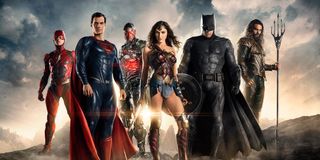 The Flash, Superman, Cyborg, Wonder Woman, Batman and Aquaman stand on a mountain in a promotional i