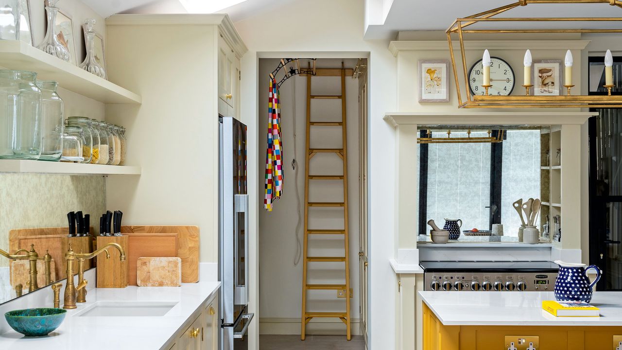 kitchen with island, white worktops and view into laundry room