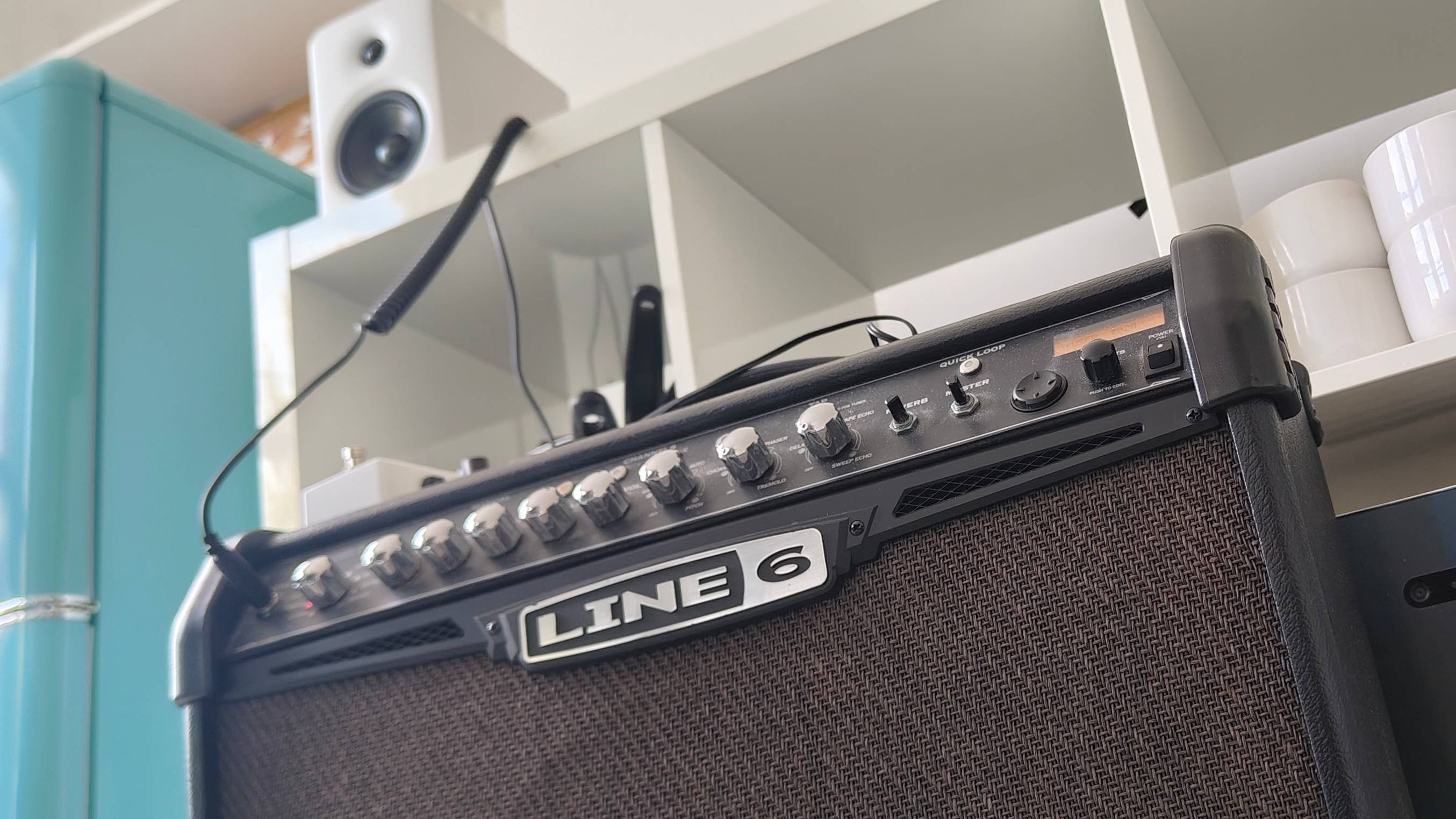 The Line 6 Spider IV amp with an Edifier speaker in the background.