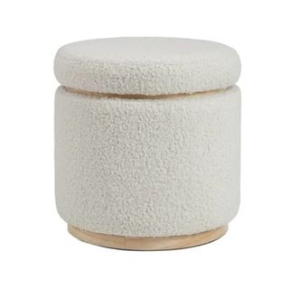 A cylinder shaped white boucle stool