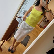 Woman wearing a skirt and ballet flats