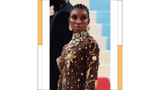 Michaela Coel wears a gold embellished dress while attending the 2023 Met Gala Celebrating "Karl Lagerfeld: A Line Of Beauty" at Metropolitan Museum of Art on May 01, 2023 in New York City.