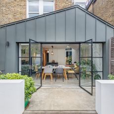 garden area with glass door and plants