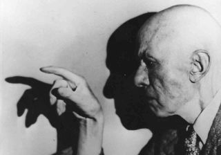 Aleister Crowley posing for a photograph in the 1940s