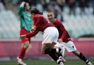 Rodrigo Taddei celebrates with Daniele De Rossi after scoring for Roma against Cagliari in December 2006.