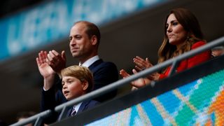 Prince William, President of the Football Association and his son Prince George along with Catherine, Duchess of Cambridge applaud after the UEFA Euro 2020 Championship Round of 16 match between England and Germany at Wembley Stadium on June 29, 2021 in London, England.