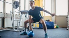 A man doing a kettlebell workout